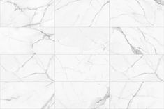 a white marble tile wall with grey veining