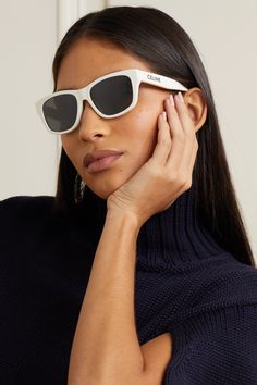 CELINE Eyewear's sunglasses have earned their cult status and this pair is sure to maintain that legacy. Part of the label's 'Monochroms' capsule, they're made from ivory acetate and minimally detailed, save for the brand's emblem. The square frames are eternally classic. White Frame Sunglasses, Celine Eyewear, Dark Sunglasses, White Sunglasses, Celine Sunglasses, Acetate Sunglasses, Eyewear Womens, The Square, Ivory Color