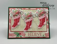 a christmas card with stockings and candy canes