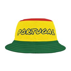 This Portugal bucket hat is a patriotic national team fan hat for any sport with the Portuguese flag colors of intense green, red and yellow with the word "Portugal" in yellow and blue on a polyester bucket hat. Makes a perfect hat for a national holiday, sporting event, Portuguese party or Halloween party costume, Halloween costume, team Portugal hat, football fan hat, soccer fan hat, soccer fan apparel, men's hat or women's hat, or just for fun! -Material: 100% polyester -Available in 2 sizes Yellow Cap For Sports Events, Yellow Snapback Hat For Sports Events, Yellow Casual Baseball Cap For Sports Events, Casual Yellow Baseball Cap For Sports Events, Sporty Multicolor Baseball Cap, Red Sports Fan Hat, Multicolor Snapback Hats For Sports Events, Sporty Yellow Hat With Curved Brim, Green Sports Bucket Hat