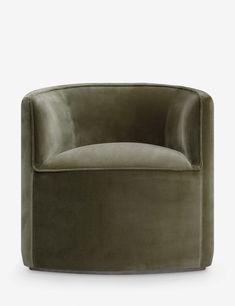 an olive green velvet tub chair on a white background