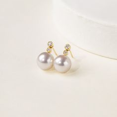 Material: 18K gold, Akoya pearl and diamond Akoya saltwater cultured pearl Size of pearl: around 8.0-8.5 mm each, 2pcs Weight of Diamonds: 4 diamonds approx. 0.082 carats Handpicked of every pearl, only top 1% of pearls are selected Handcrafted Sold as a pair Lifetime warranty