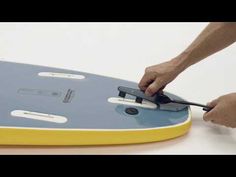 a person cutting into a board with scissors