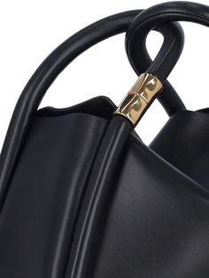 Boyy 'Wonton 25' handbag in black leather with two top handles, gold metal detail, removable shoulder strap, single inner compartment. Composition: 100% Leather Designer Black Shoulder Bag With Rolled Handles, Elegant Gold Bucket Bag With Top Carry Handle, Luxury Shoulder Bag With Rolled Round Handles, Luxury Bucket Shoulder Bag With Rolled Handles, Sleek Shoulder Bag With Gold-tone Hardware And Top Handle, Luxury Shoulder Bag With Rolled Handles For Office, Sleek Shoulder Bag With Top Handle And Gold-tone Hardware, Modern Gold Top Handle Bucket Bag, Elegant Shoulder Bag With Rolled Handles For Office