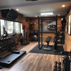 a home gym with lots of exercise equipment