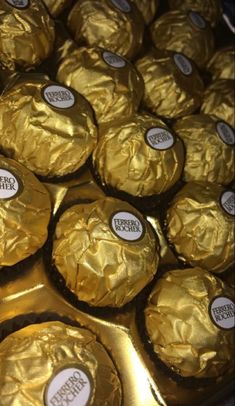 there are many chocolates wrapped in gold foil