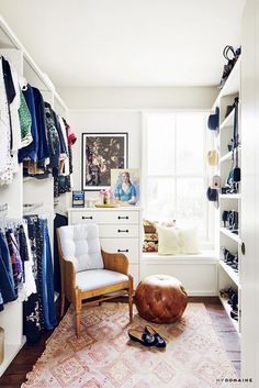 a room with a chair, rug and shoes on the floor