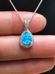 Blue Pear-shaped Birthstone Jewelry, Blue Teardrop Jewelry For Formal Occasions, Blue Drop Jewelry For Wedding, Blue Teardrop Pendant Jewelry For Formal Occasions, Sapphire Drop Necklace For Anniversary, Blue Teardrop Jewelry For Wedding, Blue Teardrop Pendant For Formal Occasions, Blue Pear-shaped Cubic Zirconia Jewelry, Blue Teardrop Wedding Jewelry