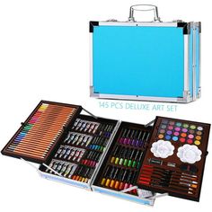 an open suitcase with lots of art supplies in it and the contents inside are shown