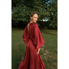 Red (100% high-grade pleated polyester). Gown. Long sleeves. V-neck. Back zipper closure. Imported. Pleated V-neck Gown For Party, Pleated V-neck Maxi Dress For Gala, Red Formal Dress With Pleated Back, Elegant Red Dress With Folds, Elegant Red Pleated Maxi Dress, V-neck Pleated Dress With Pleated Sleeves For Party, Party Gown With Draped Sleeves And V-neck, Chic Red Pleated Party Dress, Pleated Back V-neck Evening Dress