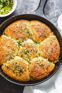 a skillet filled with bread and cheese