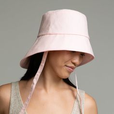 Pale pink linen asymmetric bucket hat with ties. SKU: 23508-03224 Bucket Hat Style, Eugenia Kim, Pink Linen, Fashion Jewelry Earrings, Pink Ombre, Small Accessories, Blue Leather, Pale Pink, Hat Fashion