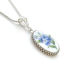 "Broken China Necklace Forget Me Not Flower Necklace Anniversary Gift for Wife Repurposed Jewelry She will love the vintage vibe and sentiment of this blue forget me not necklace. Handmade and repurposed using a vintage tea saucer. Sterling Silver victorian forget me nots china pendant necklace. Our 16\" diamond cut sterling silver rope chain is included. Choose 16\", 18\" or 20\" or 24\" when ordering. Shown on model worn at 24\". If you are not sure of chain length: Our adjustable 22\" chain i Elegant Pressed Flowers Necklace For Anniversary, Elegant Necklace With Pressed Flowers For Anniversary, Vintage Flower Jewelry Keepsake, Vintage Birth Flower Necklace For Wedding, Vintage Flower Pendant Necklace Keepsake, Vintage Flower Pendant Necklace For Keepsake, Vintage Flower Pendant Keepsake Necklace, Blue Vintage Charm Necklace For Gift, Blue Vintage Charm Necklace As Gift