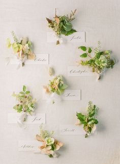 flowers and place cards are arranged on a table