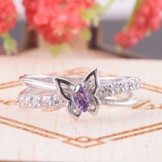 "White gold amethyst ring, Butterfly ring, 14k gold ring for her, Promise ring gold, Promise ring for her, Dainty ring gold,Marquise cut ring WE OFFER UNLIMITED PERIOD INSTALLMENTS PLAN This is a beautiful, stunning, feminine ring that works well for all occasions, styles, and ages. You will love it! Ring information: Main stone: Amethyst Approximate size: 4*2mm Accent stone: Cubic zirconia Metal type: Gold Metal stamp: 14k Gold Customization / Replacements It's easy to create jewelry that's per Fine Jewelry Lavender Hallmarked Rings, Lavender Cubic Zirconia Rings For Gift, Fine Jewelry Amethyst Ring With Open Design, Lavender Cubic Zirconia Promise Ring, Amethyst Open Ring Fine Jewelry, Purple Diamond Promise Ring In Fine Jewelry Style, Purple Topaz Ring For Promise, Fine Jewelry Purple Topaz Ring As Gift, Purple Hallmarked Birthstone Promise Ring