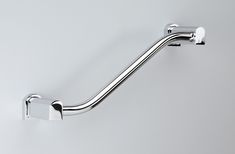 a metal handle on a white wall