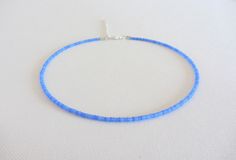 Blue Seed Bead Choker Blue Beaded Choker Blue beaded necklace Boho Bead Choker Beach Choker Seed Bead Necklace Trendy Choker sky blue Choker  Measure the length of your neck with a measuring tape or you can use any thread, rope, or cable for telephone and after apply the measurements to a regular ruler. Choker is 13 inches with a 2 inches adjustable extender chain. 15 inches full length. These are Blue beads of size 10/0. Trendy Chokers, Seed Bead Choker, Blue Choker, Necklace Trendy, Dainty Choker, Blue Beaded Necklace, Bead Choker, Boho Choker, Hippie Jewelry