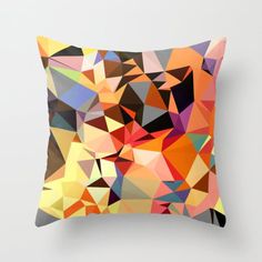 a colorful pillow with an abstract design on the front and back side, in various colors