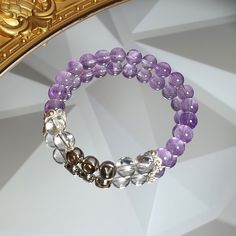 This elegant handmade bracelet features high-quality 6mm or 8mm beads made of natural lavender amethyst and clear quartz, known for their spiritual and healing properties. The amethyst promotes tranquility and spiritual growth, while clear quartz amplifies clarity and focus. What makes this bracelet truly special is the personalized alphabet beads, making it a meaningful gift for her, a family member, or a friend. Customize the size for a perfect fit, and let the personalized letters add a touch Lavender Amethyst Crystal Bracelet As Gift, Lavender Crystal Bracelet With 8mm Beads As Gift, Silver Amethyst Crystal Bracelet With 8mm Beads, Silver Amethyst Bracelet With 8mm Beads, Spiritual Lavender Amethyst Crystal Bracelet, Spiritual Purple Stackable Bracelets, Spiritual Purple Stackable Bracelet, Family Bracelet, Girly Bracelets