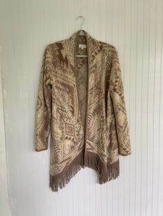 Super cozy & soft western cardigan with retro fringe Size Medium Bust: 42" Length: 36" Long Sleeve Fringe Cardigan For Fall, Fall Long Sleeve Fringe Cardigan, Cozy Long Sleeve Outerwear With Fringe, Fall Long Sleeve Fringe Sweater, Cream Fringe Outerwear For Winter, Winter Cream Outerwear With Fringe, Cream Fair Isle Pattern Outerwear For Fall, Cream Fair Isle Outerwear For Fall, Vintage Fringed Winter Outerwear