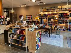 the inside of a craft shop with many items on display