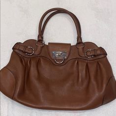 Authentic Camel Colored Ferragamo Gancini Bag With Zipper Closure And Flap. Small Scratches On Front Bottom Part, Otherwise Excellent Condition 10” High 16” Wide Ferragamo Gancini Bag, Salvatore Ferragamo Bags, Bag With Zipper, Front Bottoms, Camel Color, Hobo Bag, Kate Spade Top Handle Bag, Salvatore Ferragamo, Camel