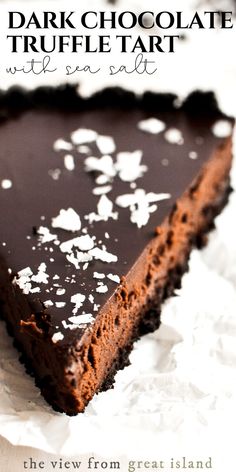 a piece of chocolate truffle tart with sea salt on top is shown