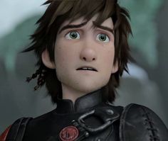 the animated character is dressed in black and has red accents on his chest, while he looks surprised