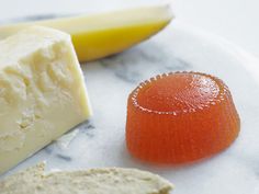 cheese and fruit are sitting on a plate