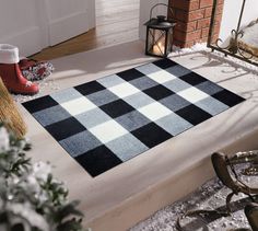 a black and white rug sitting on top of a step