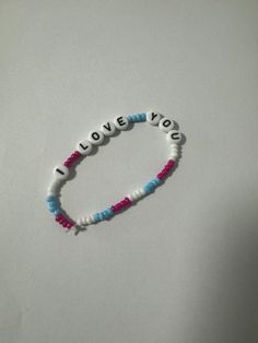 Handmade bracelet with colors to choose from and with the phrase * I love you * Trendy Letter Print Bracelets For Friendship, Trendy Letter Print Friendship Bracelets, Casual Name Bracelet For Personalized Gift, Cute Friendship Wristband With Letter Beads, Trendy Friendship Bracelets With Letter Print, Trendy Friendship Bracelets With Letter Print For Gift, Trendy Friendship Bracelets With Letter Print As Gift, Casual Pink Bracelet With Letter Print, Cute Bracelet Wristband With Letter Beads