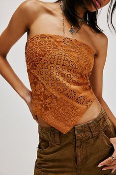 Turn heads in this timeless tank featured in a strapless, bandana-inspired design and textured lace fabrication with smocking at back for a forever flattering fit. **Fit:** Cropped, staple fit **Features:** Strapless neckline, smocking at back **Why We | FP One Raya Lace Bandana Top at Free People in Tan, Size: XL Spring Bandeau Lace Top, Spring Lace Sleeveless Tube Top, Spring Lace Bandeau Top, Lace Bandeau Top For Spring, Fitted Bandana Print Top For Spring, Fitted Bohemian Bandana Print Tops, Bohemian Fitted Strapless Tube Top, Fitted Bandeau Top For Festival, Fitted Bohemian Tube Top For Festivals