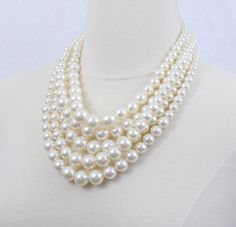 This beautiful cluster pearl necklace is made of ivory or white resin pearls in the sizes of 8mm to 16mm. The shortest strand measures 19, the longest strand is 24. Comes with a pair of FREE matching earrings. Super versatile timeless piece, can be paired with dresses or tees and Jewellery Styling, Pearl Necklace Bridal, Chunky Pearl Necklace, Pearl Necklace Choker, Layered Pearl Necklace, Chunky Pearls, Bridal Pearl Necklace, Pearl Statement Necklace, Pearl Bridal Jewelry