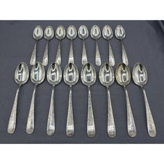 an assortment of spoons and forks with numbers on them