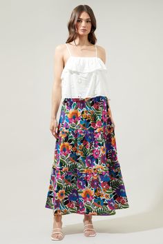 A little artsy floral action never hurt anyone. Complementary flower motifs work together to create the Santa Elena print. It decorates a tiered maxi skirt with ruffle trim. An elastic waist tops a flowy fit with side pockets. Wear it with a solid tank and sandals for an effortless, boho look.- Elastic waist- Pockets- Ruffle trim- Flowy fit- Color: Floral MultiSize + Fit - Model is 5'9" and wearing size S- Measurements taken from size S - Waist: 13 3/4"- Length: 38" Fabric Self: 100% Cotton Styl Flowy Multicolor Printed Maxi Skirt, Festival Floral Print Tiered Skirt, Red Floral Print Tiered Maxi Skirt, Summer Floral Print Voluminous Maxi Skirt, Spring Floral Print Voluminous Skirt, Ruffle Maxi Skirt, Tiered Maxi Skirt, Floral Maxi Skirt, Boho Look