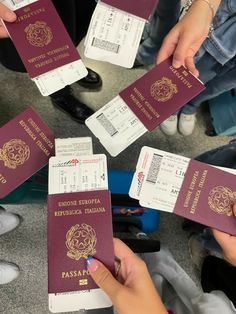 several people holding up their passport cards