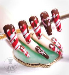 Hand painted acrylic press-on nails. White and red candy cane stripe design with chocolate drip and a peppermint bark accent nail adorned with a candy cane heart. Pictured are Long Coffins. Package comes with 10 nails, 1 mini nail file, 1 plastic cuticle pusher, 2 alcohol pads, 1 nail oil pen, 1 tube of nail glue, and 1 sheet of adhesive nail stickers. Feel free to message me before ordering for minor changes to colors, design, etc! Physical product may differ slightly, as every set of nails I o Christmas Nail Art Peppermint, Christmas Nail Art Candy Cane, Christmas Cookie Nail Art, Peppermint Nail Designs, Chocolate Drip Nails, Christmas Accent Nails, Checkered Christmas Nails, Candy Christmas Nails, Hot Cocoa Nails