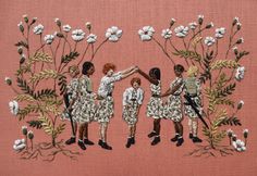 an embroidered image of four children reaching out to touch each other's hands with flowers in the background