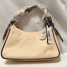 Dooney & Bourke Medium Hobo, Purse, Handbag, Cream, Brown Trim, White Interior Pockets, Key Chain, Adjustable Wide Shoulder Strap, Gold Hardware Base 11.5” Wide. 3.5” Deep Height 6” At Center Low Point Nwt Original Packaging, Dust Bag Brown Leather Satchel, Pink Monogram, Vintage Shoulder Bag, Hobo Purse, Brown Crossbody, Brown Trim, Brown Shoulder Bag, Navy And Brown, Brown Leather Strap