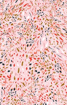 an abstract pink background with black, red and yellow spots on it's surface