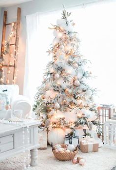 a white christmas tree in a living room