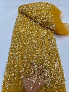 This high quality Fabric is measured in 5 Yards With Embroidered Beading and Sequin. It is soft, very delicate and beautiful. This high Quality Fabric is made with Fashion embroidered rhinestones can be used in making party wedding dresses, skirts, shawls, scarves and other other fashion apparels as you would like. Size : Length : 5 yards (180 inch). Width: 50 inch (Please allow slight deviation for the measurement data ,±1 inch) Material: 100% Polyester, Tulle Lace Fabric, Eco-Friendly embroidery Luxury Festive Sequin Fabric With Zari Work, Luxury Elegant Sequin Fabric With Zari Work, Luxury Sequin Fabric For Diwali, Luxury Sequin Fabric In Traditional Drape For Festivals, Luxury Women's Sequin Fabric For Diwali, Luxury Traditional Sequin Fabric For Party, Luxury Sequin Fabric For Diwali Party Wear, Luxury Traditional Sequin Fabric For Diwali, Luxury Floor-length Embroidered Fabric For Diwali