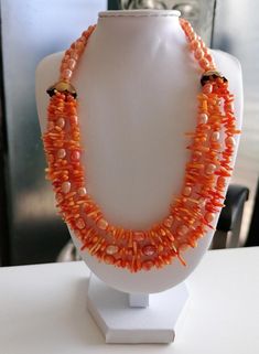 Handmade orange necklace made of coral and freshwater pearls. The length of the 3-row chain is approx. 44 cm plus an extension chain of approx. 5 cm. The orange freshwater pearls are 5 mm - 10 mm, the coral branches are 5 mm - 13 mm. The chain clasp, extension chain and pearl caps are gold in color. Available immediately. The color, size and shape of the beads may vary. The colors of the beads may vary depending on camera and monitor settings. Combined shipping possible. If you purchase multiple Astrology Spirituality, Necklace With Pearls, Orange Necklace, Orange Coral, Coral Necklace, New Energy, Bridesmaids Gifts, Necklace Handmade, Jewelry Handmade