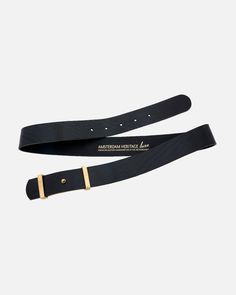 two black leather belts with gold buckles on each side, one has a logo and the other has a name