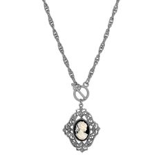 A true vintage inspired design, this necklace features an ornately made filigree vine pendant accented with European crystals & comes with a cameo at the center. The pendant dangles from a toggle, link to a knurled double rope chain. Available In Silver Tone And Black & Carnelian Red And 14K Gold Dipped. Ornately Designed Filigree Vine Pendant With European Crystal Measurements: 26""L 1928 Jewelry Collection From the vaults of rich European capitals to the antique laden attics of old American es Cameo Pendant Necklace, Chic Fashionista, 1928 Jewelry, Filigree Jewelry, Vintage Inspired Jewelry, Cameo Jewelry, Cameo Pendant, Gold Dipped, Vintage Inspired Design