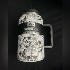 an image of a coffee mug with skulls on the front and back cover that says quench 500x