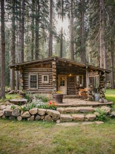 a log cabin in the woods with steps leading up to it