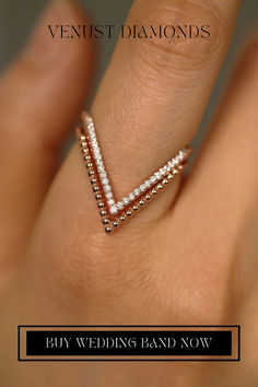 a woman's hand with a diamond ring on it and the words, buy wedding band now