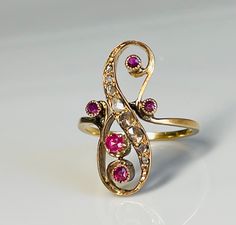 Rare late Georgian era/early Victorian era French rose cut diamond and earth mined ruby ring in 18K rose gold from the early to mid 1800s. The stones are wonderful old rose cut diamonds with foil backing and collet set rubies. The diamonds in this ring would have sparkled beautifully in candlelight. The rubies are natural earth mined stones with deep color saturation and nice clarity. The largest diamond measures about 3 mm across (1) the next two graduated diamonds measure 2 mm each (2) 1.2 mm Victorian Multi-stone Ruby Wedding Ring, Gold Victorian Ruby Ring With Single Cut Diamonds, Victorian 14k Gold Ruby Ring, Antique Engagement Rings Victorian, Victorian Multi-stone Ruby Ring Gift, Victorian Ruby Ring With Multi-stone In Gold, Ruby Solitaire Ring, Rose Cut Diamond Ring, Natural Ruby Ring