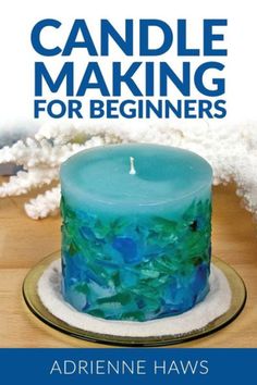 a blue candle sitting on top of a wooden table